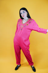long sleeve hot pink jumpsuit with jewels around neckline and cuffs vintage 1980's