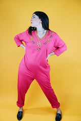 long sleeve hot pink jumpsuit with jewels around neckline and cuffs vintage 1980's
