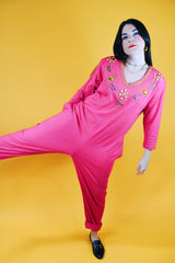 long sleeve hot pink jumpsuit with jewels around neckline and cuffs vintage 1980's