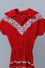 short sleeve red 1960's vintage square dance dress with white and silver ribbon trim all over