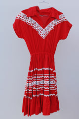 short sleeve red 1960's vintage square dance dress with white and silver ribbon trim all over