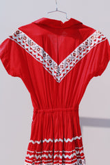 short sleeve red 1960's vintage square dance dress with white and silver ribbon trim all over