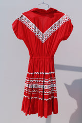 short sleeve red 1960's vintage square dance dress with white and silver ribbon trim all over