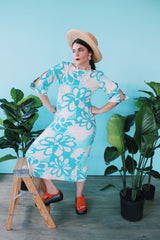 Women's vintage 1970's Polynesian Casuals, Honolulu 3/4 arm length midi length blue and white Hawaiian print dress in cotton material with cut out details on sleeves.