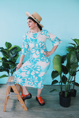 Women's vintage 1970's Polynesian Casuals, Honolulu 3/4 arm length midi length blue and white Hawaiian print dress in cotton material with cut out details on sleeves.