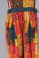 yellow red brown and black printed sleeveless ankle length apron pinafore dress vintage 1970's