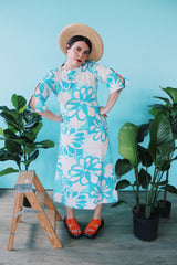 Women's vintage 1970's Polynesian Casuals, Honolulu 3/4 arm length midi length blue and white Hawaiian print dress in cotton material with cut out details on sleeves.