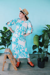 Women's vintage 1970's Polynesian Casuals, Honolulu 3/4 arm length midi length blue and white Hawaiian print dress in cotton material with cut out details on sleeves.
