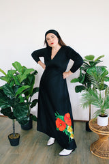 Women's vintage 1970's long sleeve maxi length black polyester material dress with big red and green flower graphic on the side