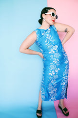 Women's vintage 1960's Made in Hawaii for Andrade Resort Shops Waikiki label sleeveless ankle length blue Hawaiian print dress with all over white floral print and white trim.