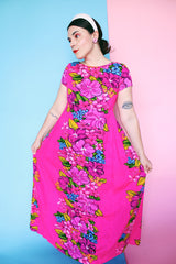 Women's vintage 1960's Skirts & Blouses Specialty Shop Honolulu label short sleeve ankle length bright pink cotton material dress with all over Hawaiian floral print.