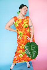 Women's vintage 1970's ears Hawaiian Fashions label sleeveless cotton material ankle length orange dress with all Hawaiian floral print.
