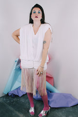 Women's vintage 1980's sleeveless mini length white dress with a drop waist and fringe overlay on bottom skirt.
