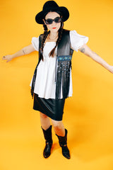 sleeveless black leather vest with beaded fringe hem vintage women's