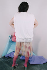 Women's vintage 1980's sleeveless mini length white dress with a drop waist and fringe overlay on bottom skirt.