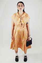 short sleeve midi length orange and pink paisley print a line dress vintage 1950's