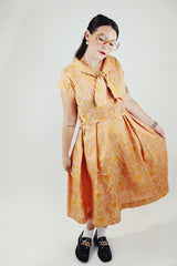 short sleeve midi length orange and pink paisley print a line dress vintage 1950's