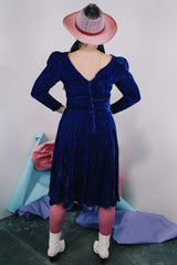 Women's vintage 1960's long sleeve midi length blue velvet dress with slight puff sleeves