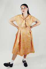 short sleeve midi length orange and pink paisley print a line dress vintage 1950's