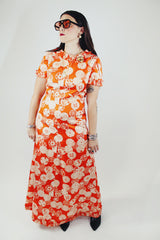 short sleeve maxi length orange printed dress with ruffle trim vintage 1970's