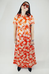short sleeve maxi length orange printed dress with ruffle trim vintage 1970's