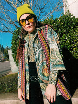 Women's or men's vintage 1970's Montgomery Ward label short sleeves on the long side, button up shirt with pointy collar in an all over abstract print in greens and yellows.