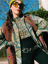 Women's or men's vintage 1970's Montgomery Ward label short sleeves on the long side, button up shirt with pointy collar in an all over abstract print in greens and yellows.