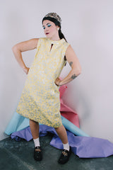 Women's vintage 1960's R & K Originals label sleeveless knee length shift dress in yellow with all over floral silver metallic embroidery.