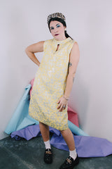 Women's vintage 1960's R & K Originals label sleeveless knee length shift dress in yellow with all over floral silver metallic embroidery.