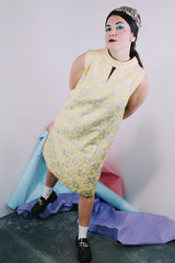 Women's vintage 1960's R & K Originals label sleeveless knee length shift dress in yellow with all over floral silver metallic embroidery.