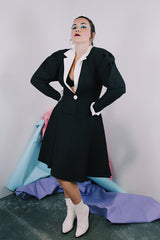 Women's vintage 1980's cotton waffle knit long sleeve knee length midi dress in black with whit double lapel collar and white trim on cuffs.