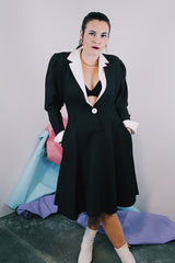 Women's vintage 1980's cotton waffle knit long sleeve knee length midi dress in black with whit double lapel collar and white trim on cuffs.