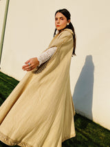 beige wool poncho ape with beaded and gold ribbon trim and pointy collar vintage women's 1960's