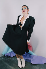 Women's vintage 1980's cotton waffle knit long sleeve knee length midi dress in black with whit double lapel collar and white trim on cuffs.