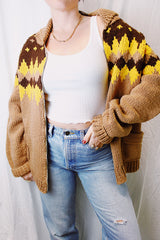 long sleeve zip up cowichan style sweater in camel brown with dark brown and yellow print around neck