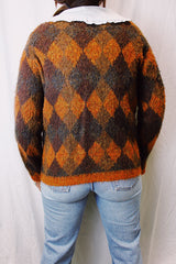 long sleeve acrylic sweater with silver metal buttons in orange and brown argyle print