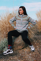 long sleeve grey wool norwegian sweater with red and green and white print and silver buttons