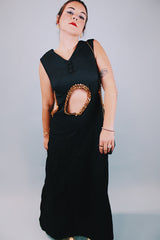 vintage 1970's ankle length black sleeveless dress with waist cut outs that have gold sequined trim