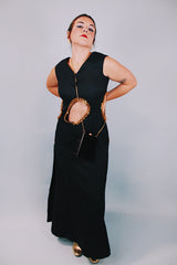 vintage 1970's ankle length black sleeveless dress with waist cut outs that have gold sequined trim