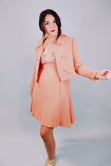salmon colored 1960's vintage dress and jacket set dress is sleeveless and has beaded top