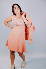 salmon colored 1960's vintage dress and jacket set dress is sleeveless and has beaded top