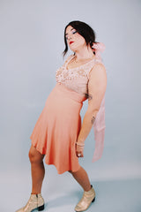 salmon colored 1960's vintage dress and jacket set dress is sleeveless and has beaded top