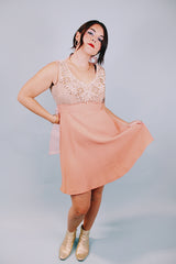 salmon colored 1960's vintage dress and jacket set dress is sleeveless and has beaded top