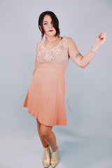 salmon colored 1960's vintage dress and jacket set dress is sleeveless and has beaded top