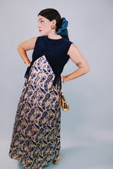 vintage 1970's sleeveless ankle length dress with navy velvet top half and gold metallic paisley printed bottom half