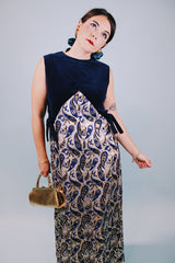 vintage 1970's sleeveless ankle length dress with navy velvet top half and gold metallic paisley printed bottom half