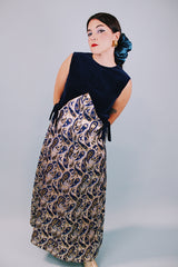 vintage 1970's sleeveless ankle length dress with navy velvet top half and gold metallic paisley printed bottom half