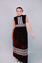 sleeveless floor length maroon velvet dress with mock neck and white striped details