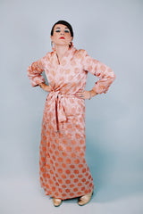 long sleeve peach colored 1950's silky shiny robe with rose print all over