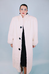 long sleeve ankle length vintage 1980's white faux fur coat with black buttons and mandarin collar